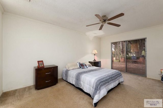 carpeted bedroom with access to exterior, ceiling fan, a textured ceiling, and ornamental molding