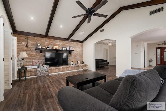 living room featuring ceiling fan, beamed ceiling, brick wall, high vaulted ceiling, and wood-type flooring