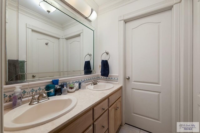 bathroom featuring tile patterned flooring, vanity, and ornamental molding