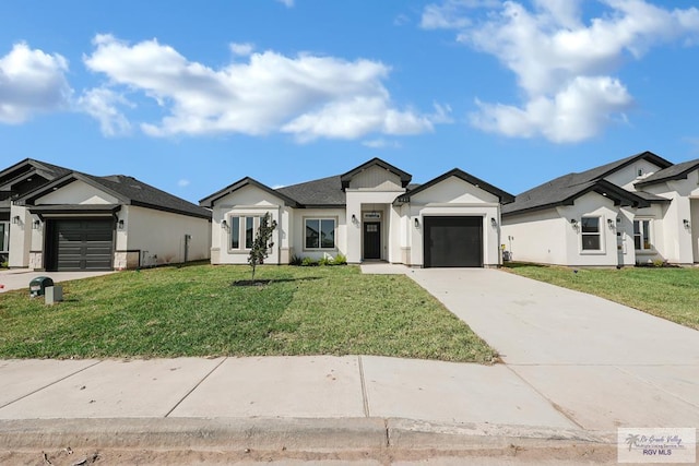 view of front of home featuring a garage and a front lawn