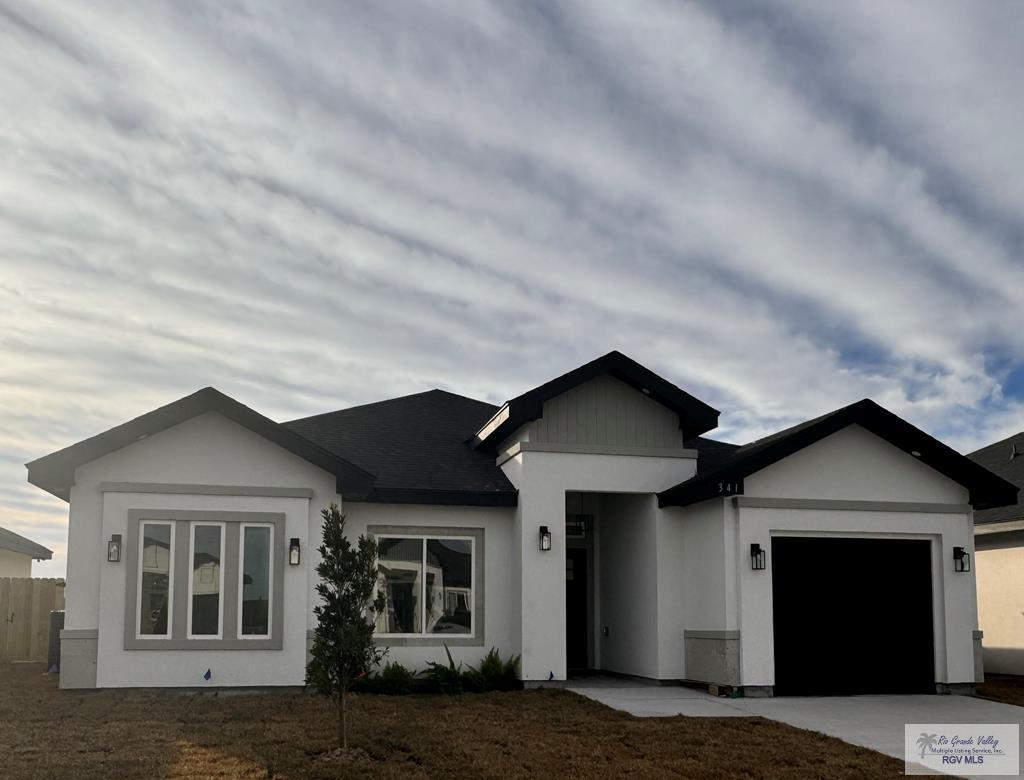 ranch-style home with a garage