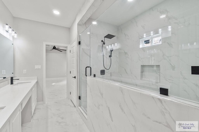 bathroom with vanity, a shower with door, and ceiling fan