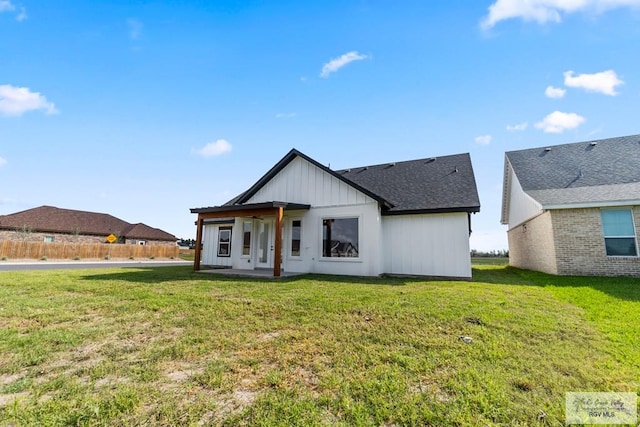 modern farmhouse style home with a front yard