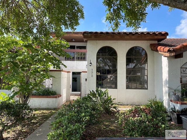 entrance to property with a balcony