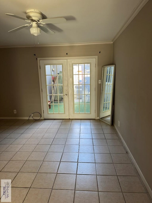 entryway with light tile patterned floors, ornamental molding, french doors, and ceiling fan