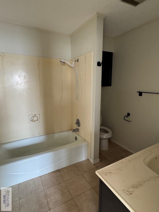 full bathroom featuring toilet, bathing tub / shower combination, a textured ceiling, vanity, and tile patterned flooring