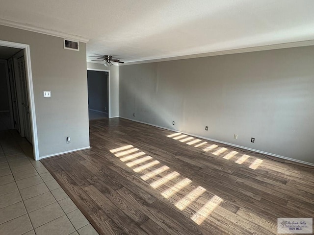 spare room with ornamental molding, hardwood / wood-style floors, and ceiling fan