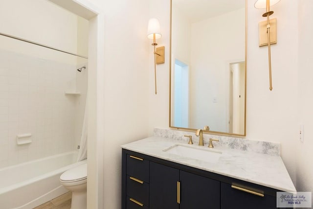 full bathroom with tiled shower / bath, hardwood / wood-style floors, vanity, and toilet