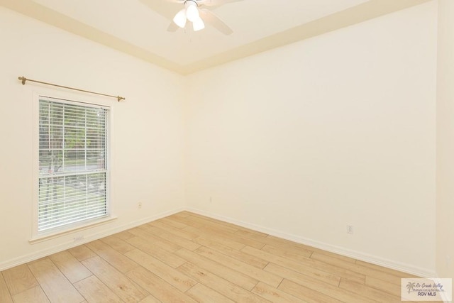 spare room featuring ceiling fan and light wood-type flooring