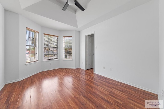 4217 W Ithaca Ave, Mcallen, TX 78501 - spare room with ceiling fan, wood finished floors, a tray ceiling, and baseboards