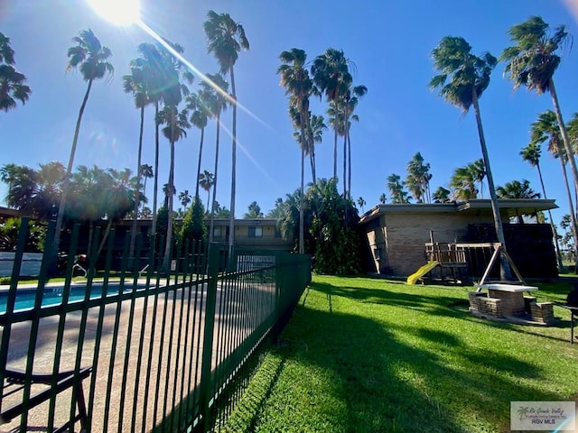 exterior space with playground community and fence