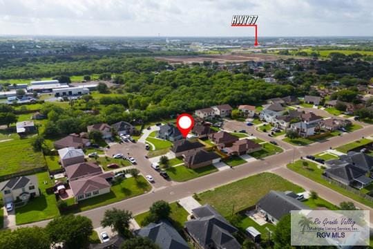 18186 King Palm Dr, Harlingen, TX 78552 - aerial view of property and surrounding area with nearby suburban area