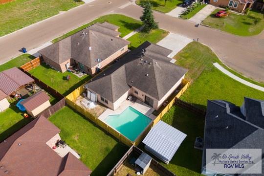18186 King Palm Dr, Harlingen, TX 78552 - aerial perspective of suburban area with a pool