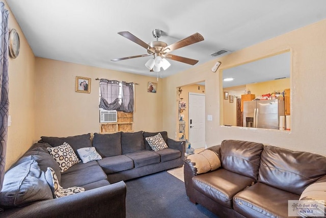 living room featuring ceiling fan and cooling unit