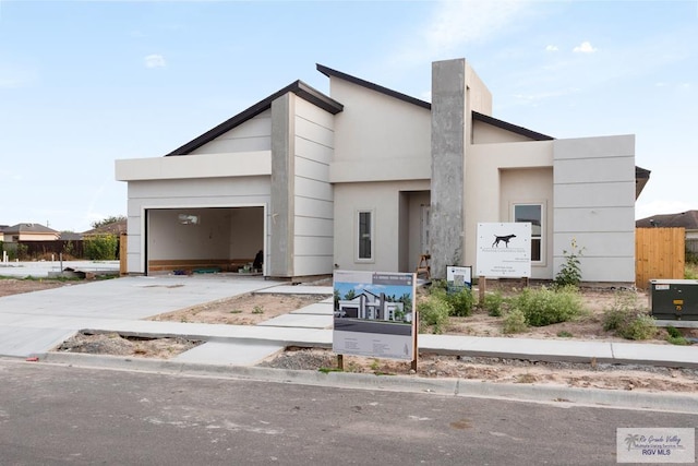 contemporary home featuring driveway and a garage