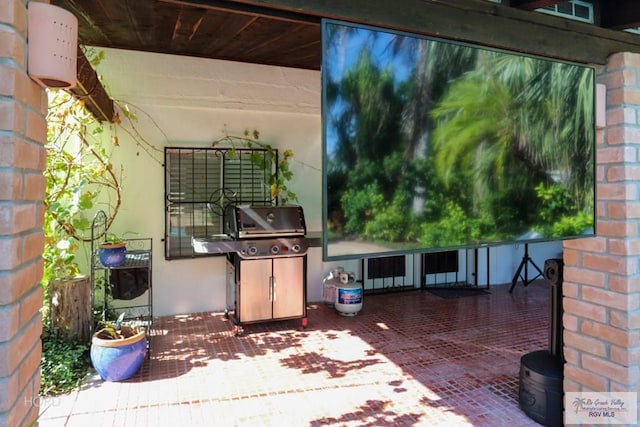 view of patio with a grill