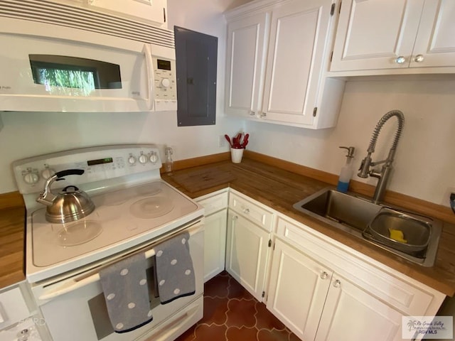 kitchen featuring electric panel, white cabinetry, sink, and white appliances