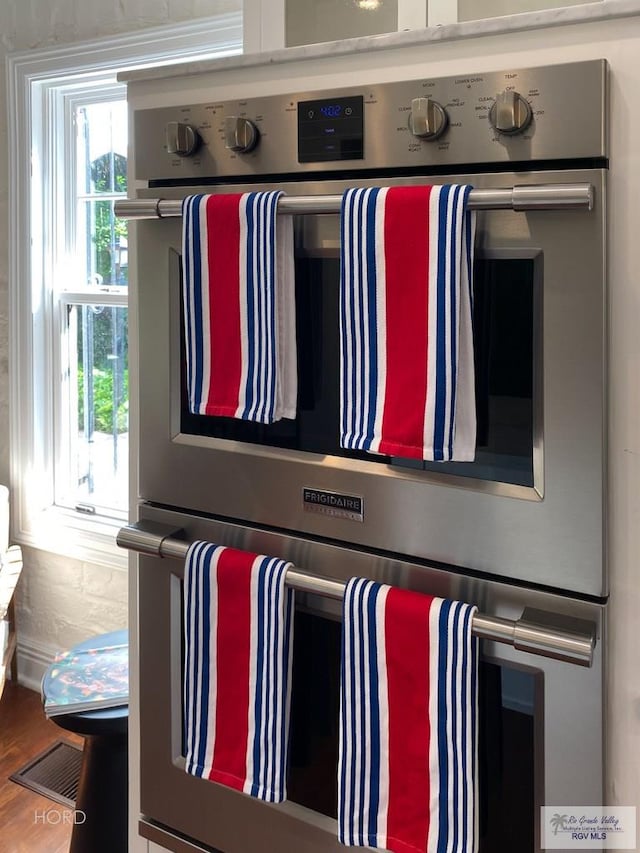 interior details featuring stainless steel double oven