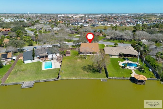 bird's eye view featuring a water view and a residential view