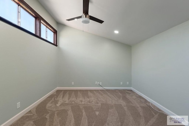 carpeted empty room with recessed lighting, a ceiling fan, and baseboards