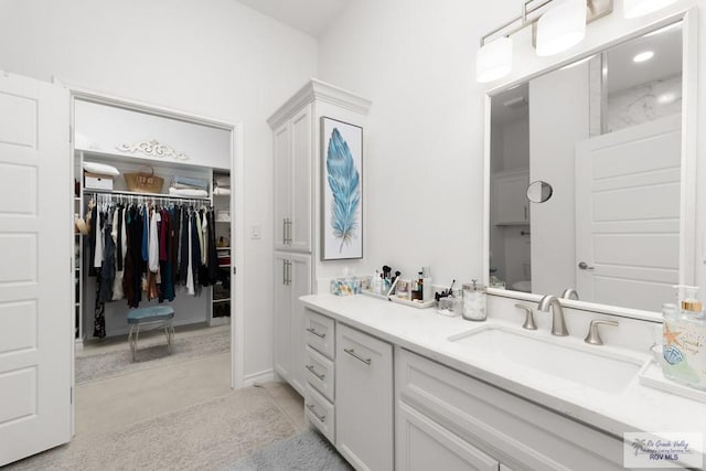 bathroom featuring tile patterned floors and vanity