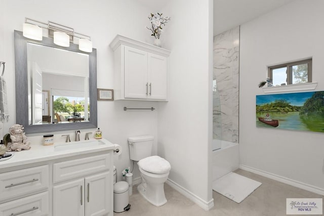 full bathroom with toilet, vanity, and tiled shower / bath combo