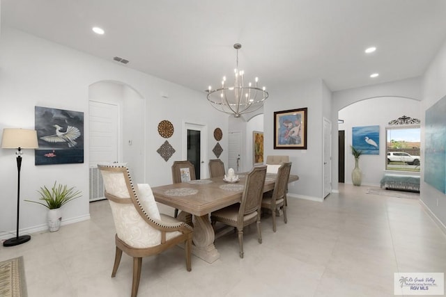 dining room with a notable chandelier