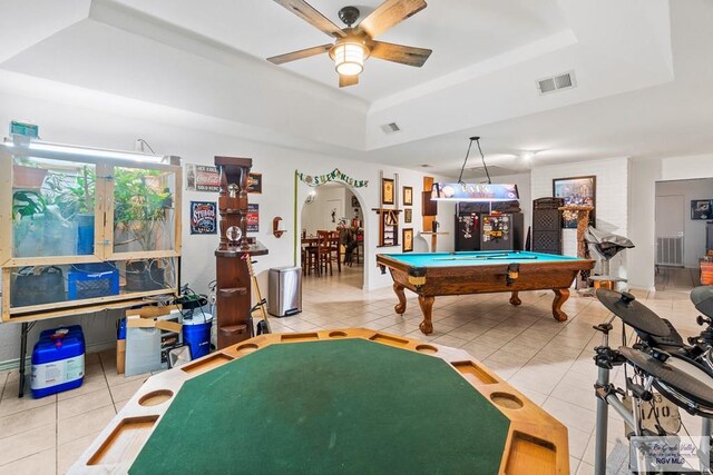 1000 E Palm Valley Dr, Palm Valley, TX 78552 - rec room with a raised ceiling, tile patterned flooring, a ceiling fan, billiards table, and arched walkways