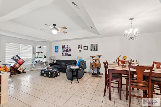 1000 E Palm Valley Dr, Palm Valley, TX 78552 - living area with light tile patterned floors, a tray ceiling, a chandelier, and ceiling fan