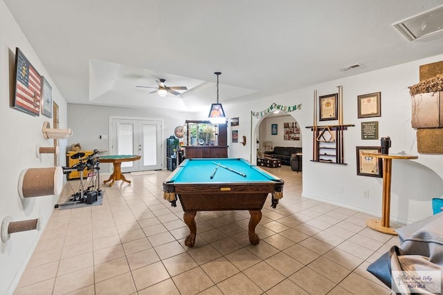 1000 E Palm Valley Dr, Palm Valley, TX 78552 - rec room featuring ceiling fan, light tile patterned flooring, pool table, a tray ceiling, and arched walkways