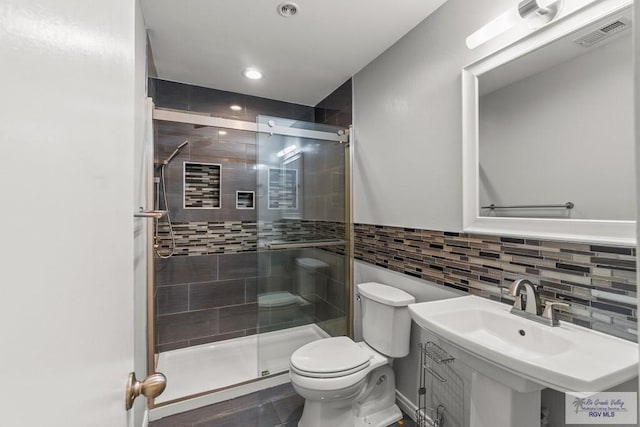 1000 E Palm Valley Dr, Palm Valley, TX 78552 - full bath with a shower stall, recessed lighting, tile walls, and backsplash