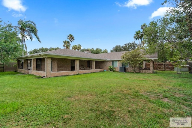 1000 E Palm Valley Dr, Palm Valley, TX 78552 - rear view of house with brick siding