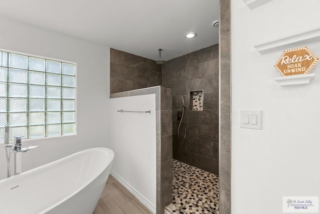 1000 E Palm Valley Dr, Palm Valley, TX 78552 - bathroom with a freestanding bath, walk in shower, and recessed lighting