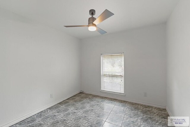 1000 E Palm Valley Dr, Palm Valley, TX 78552 - empty room featuring a ceiling fan and baseboards