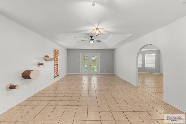1000 E Palm Valley Dr, Palm Valley, TX 78552 - unfurnished room featuring a ceiling fan, light tile patterned floors, and arched walkways