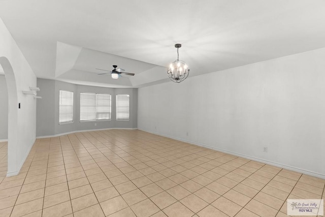 1000 E Palm Valley Dr, Palm Valley, TX 78552 - unfurnished room featuring ceiling fan, arched walkways, a raised ceiling, a chandelier, and light tile patterned flooring