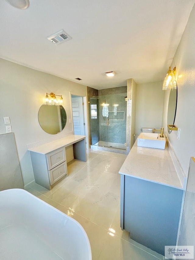 bathroom with vanity and shower with separate bathtub