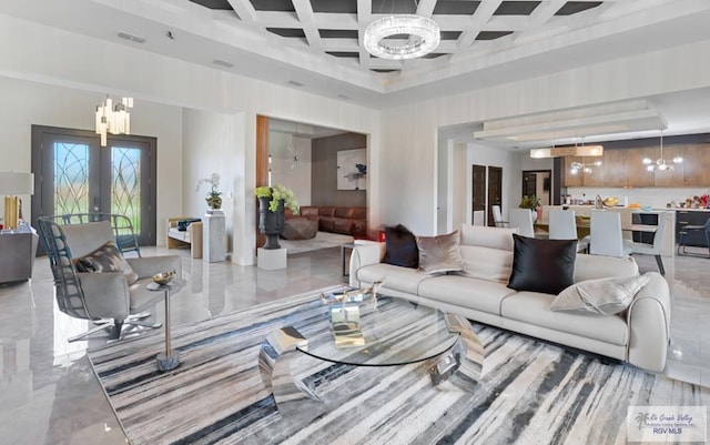 living room featuring a notable chandelier, french doors, and coffered ceiling