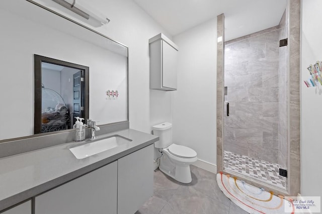 bathroom with a shower with door, vanity, and toilet