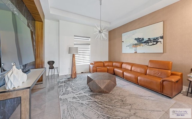 living room featuring a notable chandelier