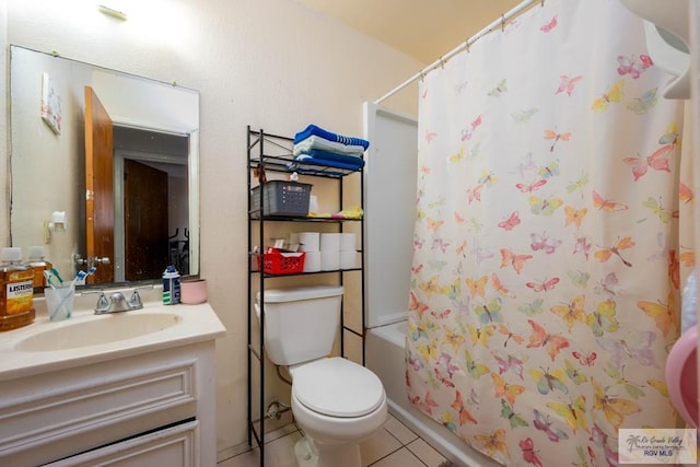 bathroom with tile patterned floors, toilet, shower / tub combo with curtain, and vanity