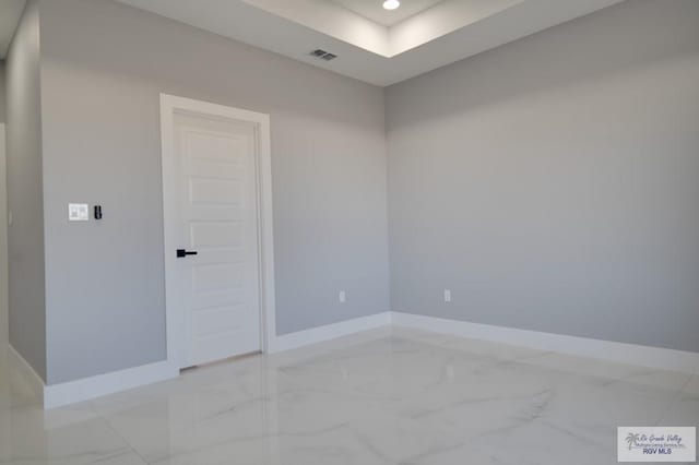 empty room featuring recessed lighting, visible vents, marble finish floor, and baseboards