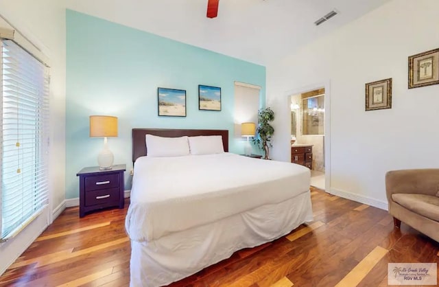 bedroom featuring ensuite bathroom, ceiling fan, and hardwood / wood-style flooring