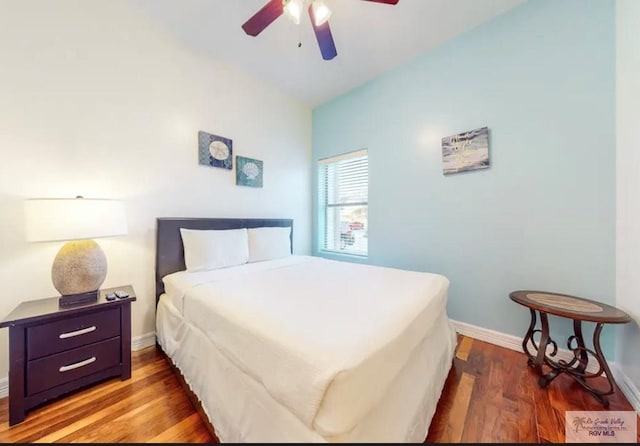 bedroom with hardwood / wood-style flooring and ceiling fan