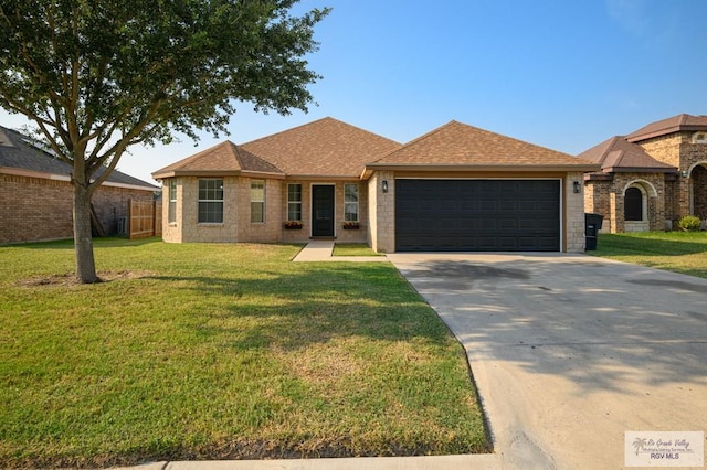 ranch-style house featuring a front yard and a garage