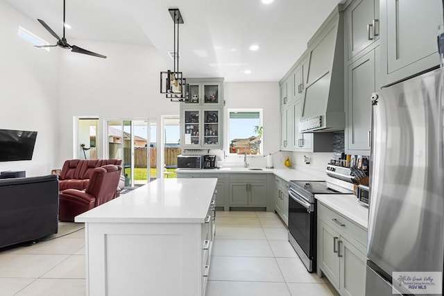 1749 Vincent St, Donna, TX 78537 - kitchen with a ceiling fan, open floor plan, stainless steel appliances, and light tile patterned floors