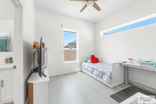 1749 Vincent St, Donna, TX 78537 - bedroom with a ceiling fan, baseboards, and light tile patterned floors
