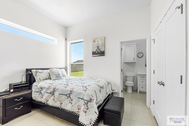 1749 Vincent St, Donna, TX 78537 - bedroom with ensuite bathroom and light tile patterned floors
