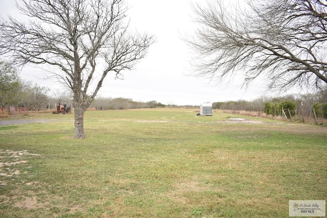 view of yard with a rural view