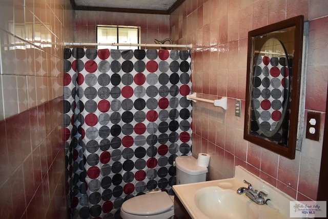 bathroom featuring vanity, tile walls, walk in shower, and toilet